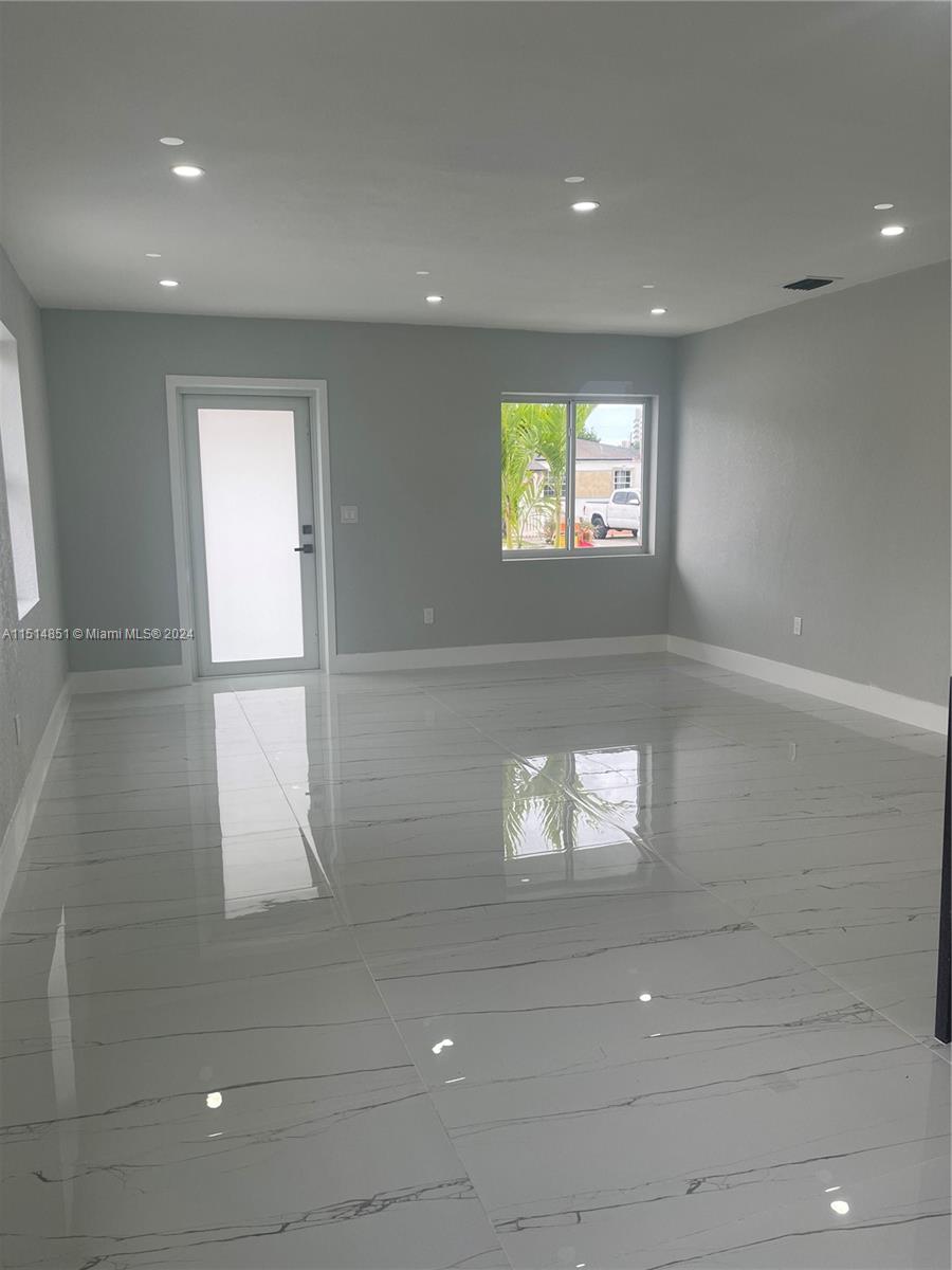516 Southwest 66th Avenue Miami, FL 33144 - Photo 2 of 27 a view of an empty room and window