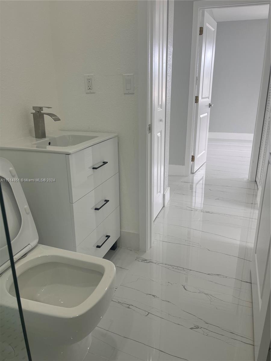 516 Southwest 66th Avenue Miami, FL 33144 - Photo 24 of 27 a bathroom with a tub and shower