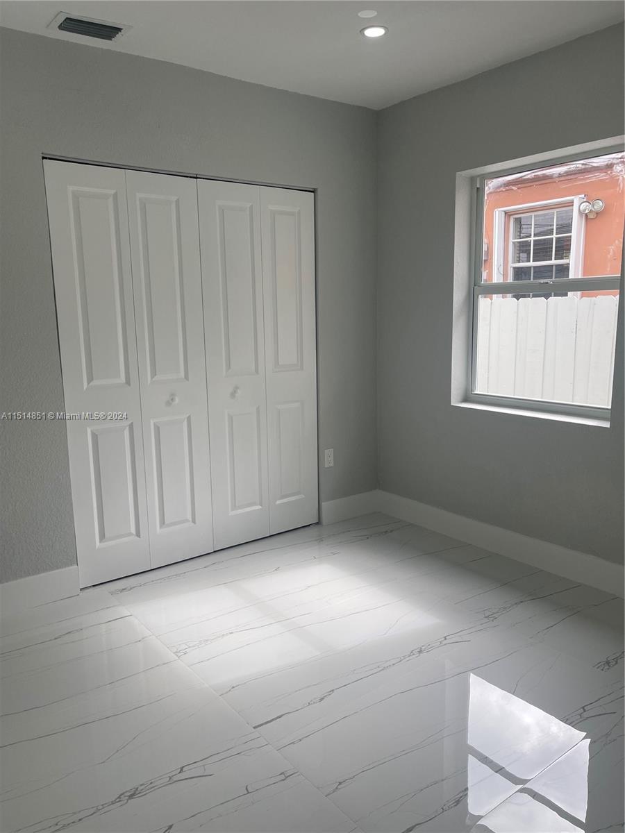 516 Southwest 66th Avenue Miami, FL 33144 - Photo 26 of 27 a view of an empty room with a window