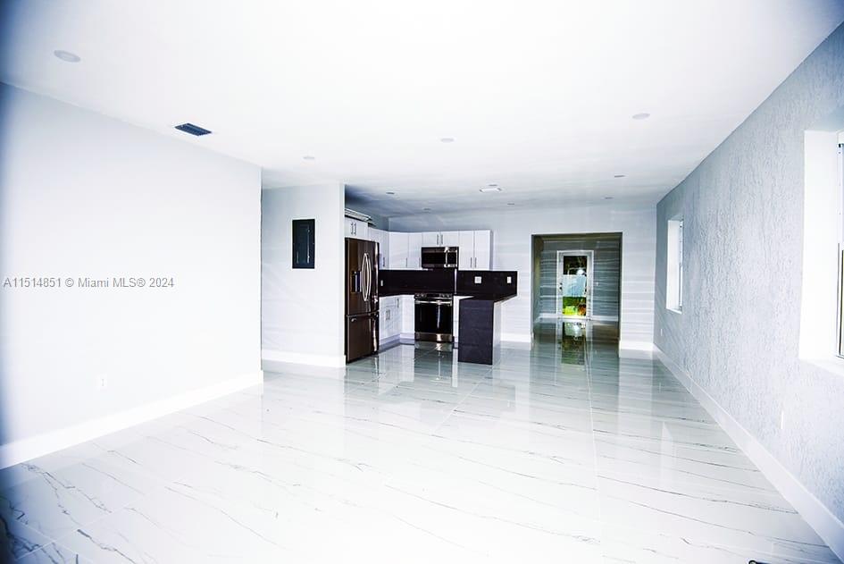 516 Southwest 66th Avenue Miami, FL 33144 - Photo 3 of 27 a workspace with furniture and window