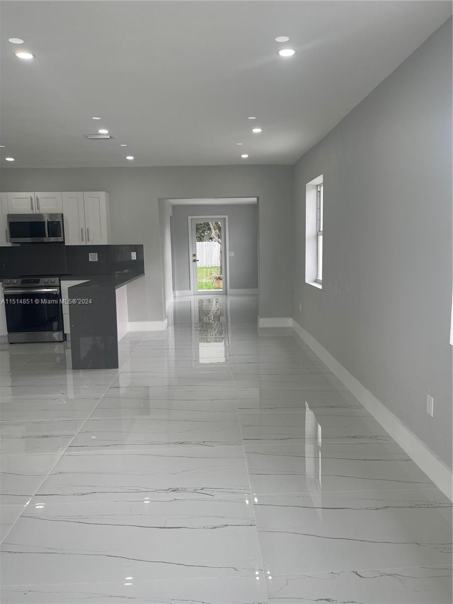 516 Southwest 66th Avenue Miami, FL 33144 - Photo 8 of 27 a view of kitchen with refrigerator and window