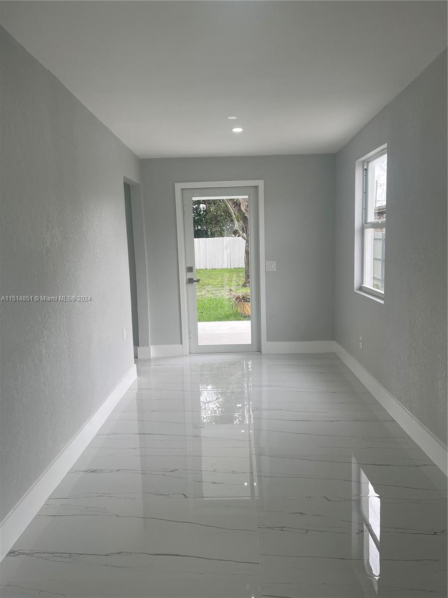516 Southwest 66th Avenue Miami, FL 33144 - Photo 10 of 27 a view of an empty room with a window
