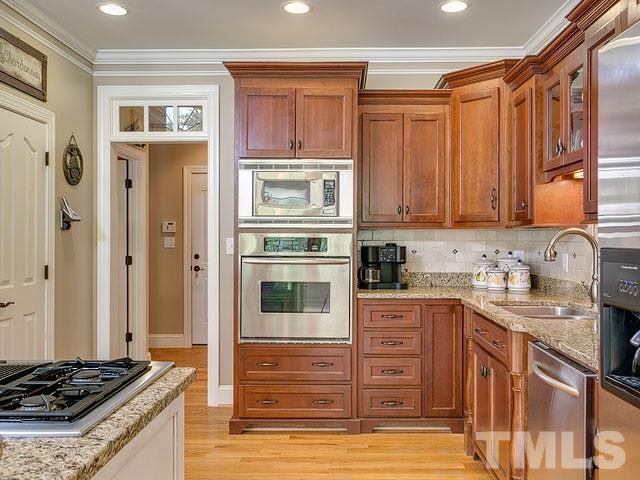 1378 Bowen Road Rougemont, NC 27572 - Photo 11 of 25 a kitchen with stainless steel appliances granite countertop a stove and a refrigerator