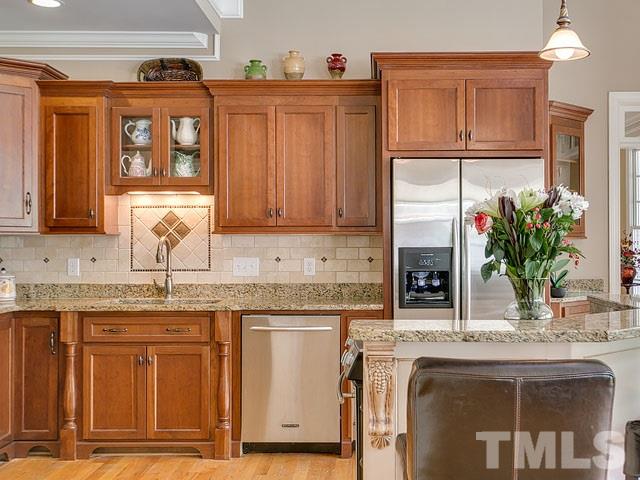 1378 Bowen Road Rougemont, NC 27572 - Photo 12 of 25 a kitchen with kitchen island granite countertop a sink and wooden cabinets