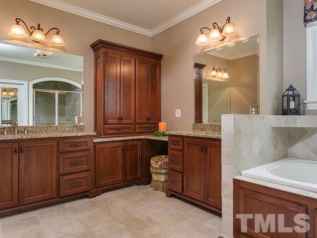 1378 Bowen Road Rougemont, NC 27572 - Photo 18 of 25 a bathroom with a double vanity sink and a mirror