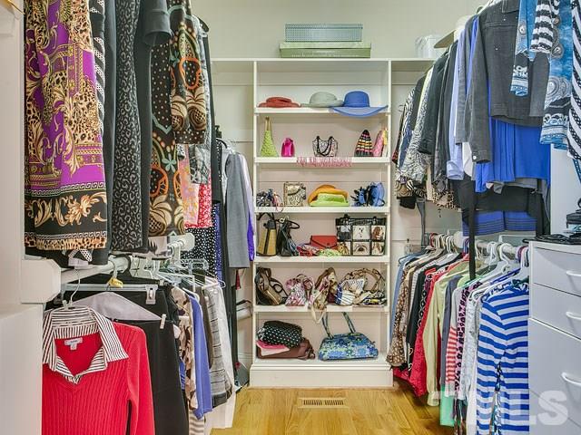 1378 Bowen Road Rougemont, NC 27572 - Photo 19 of 25 a view of walk in closet with clothes and shoes