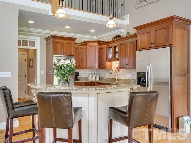 1378 Bowen Road Rougemont, NC 27572 - Photo 10 of 25 a kitchen with a table chairs refrigerator and microwave