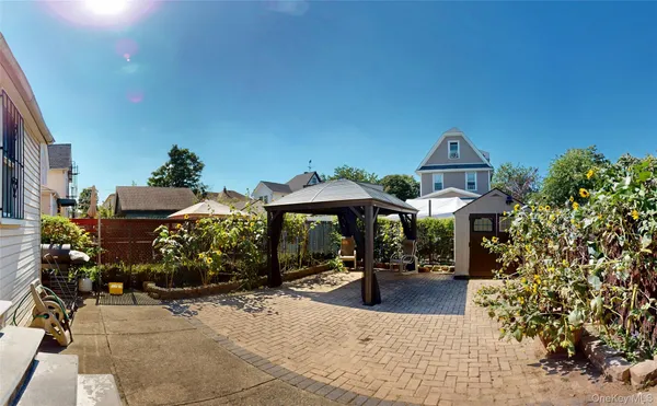 a view of a patio with chair and tables