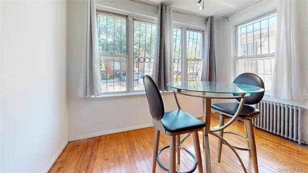 a view of a dining room with furniture window and outside view