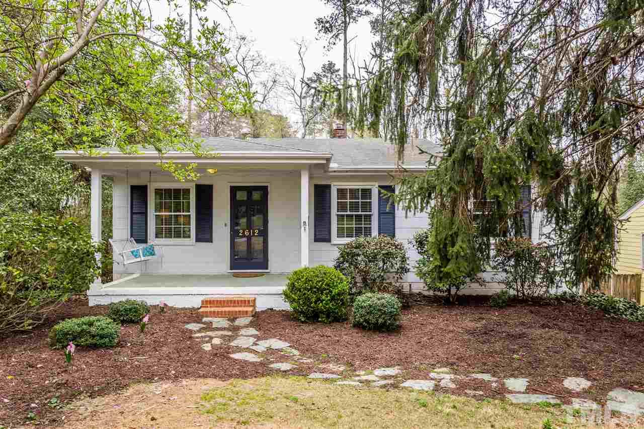 2612 Barmettler Street Raleigh, NC 27607 - Photo 1 of 24 a front view of a house with a yard