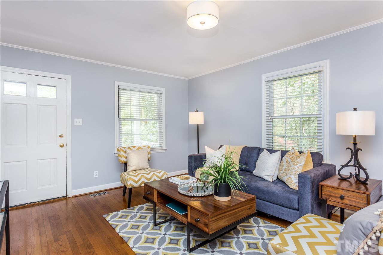 2612 Barmettler Street Raleigh, NC 27607 - Photo 2 of 24 a living room with furniture and wooden floor