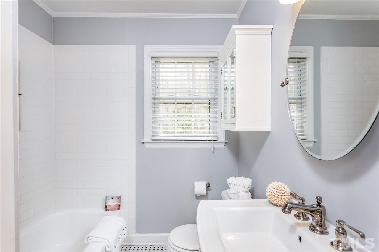 2612 Barmettler Street Raleigh, NC 27607 - Photo 15 of 24 a bathroom with a sink and a toilet
