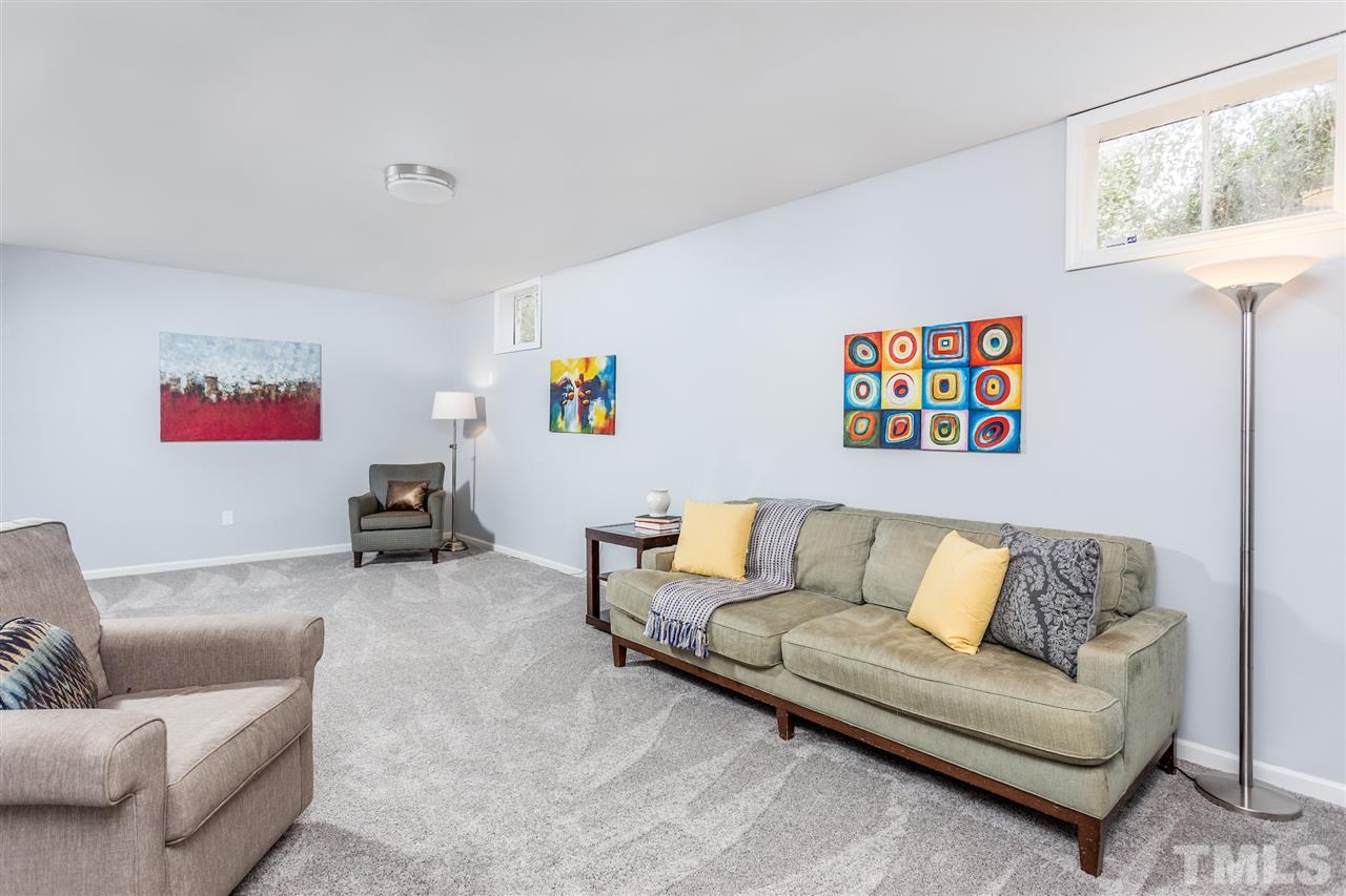 2612 Barmettler Street Raleigh, NC 27607 - Photo 17 of 24 a living room with furniture and a couch