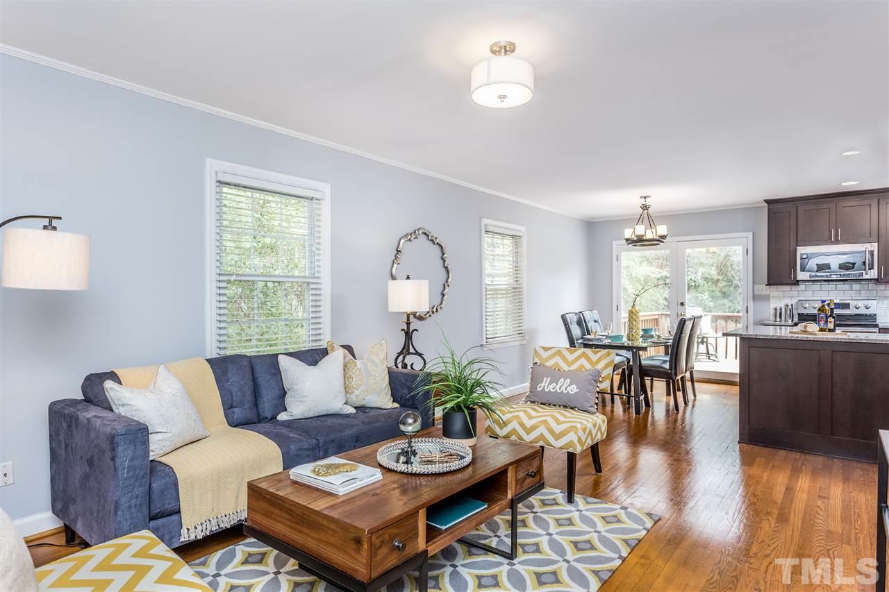 2612 Barmettler Street Raleigh, NC 27607 - Photo 3 of 24 a living room with furniture kitchen view and a window