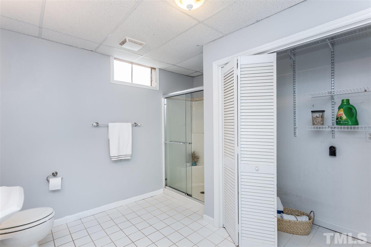 2612 Barmettler Street Raleigh, NC 27607 - Photo 21 of 24 a bathroom with a toilet and a shower