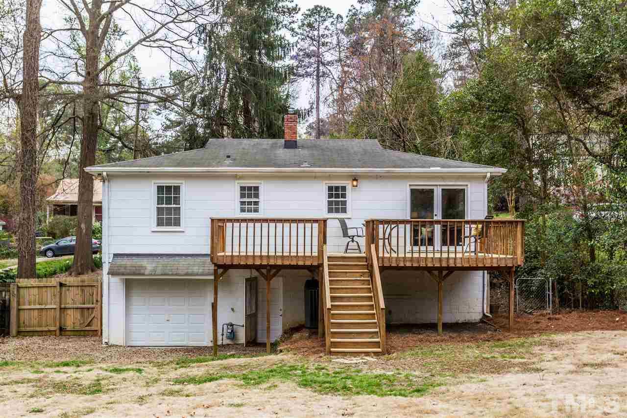 2612 Barmettler Street Raleigh, NC 27607 - Photo 23 of 24 a view of a house with a balcony and yard