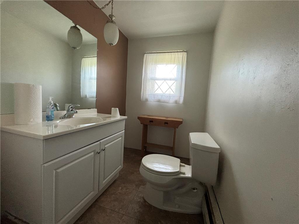 231 Laurel Road Lehighton, PA 18235 - Photo 17 of 36 A single vanity features a white countertop alongside a classic window illuminating the space.