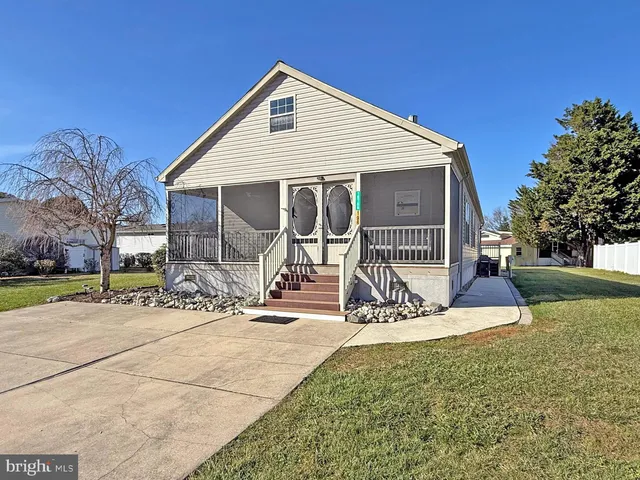 a view of a house with wooden fence
