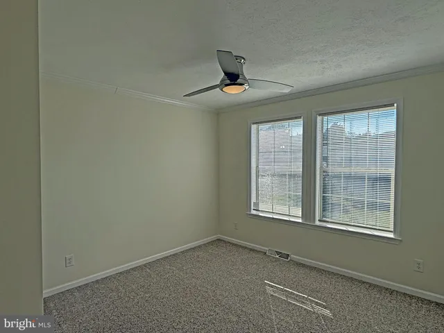 a view of a chandelier fan and closet