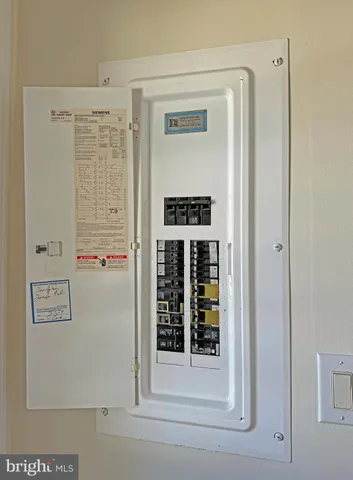 a view of backyard with a barn and a potted plant