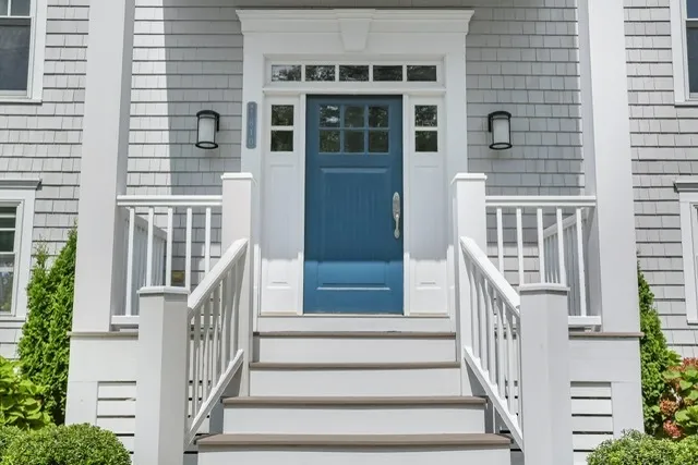a front view of a house with a large window