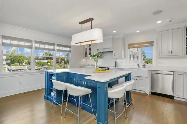 a kitchen that has a table and chairs in it