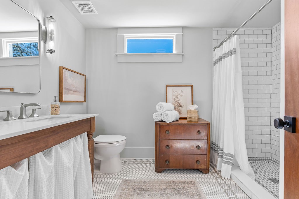 4117 Avenue R Galveston, TX 77550 - Photo 18 of 39 a bathroom with a sink toilet and shower