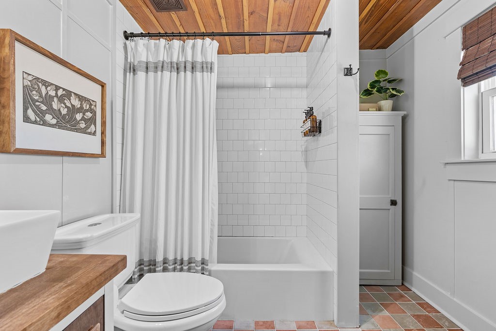 4117 Avenue R Galveston, TX 77550 - Photo 39 of 39 a white toilet sitting next to a bath tub shower