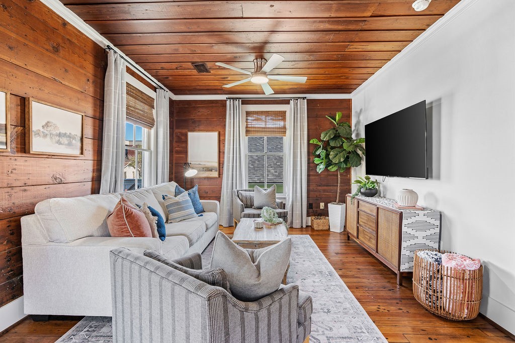 4117 Avenue R Galveston, TX 77550 - Photo 7 of 39 a living room with furniture and a flat screen tv