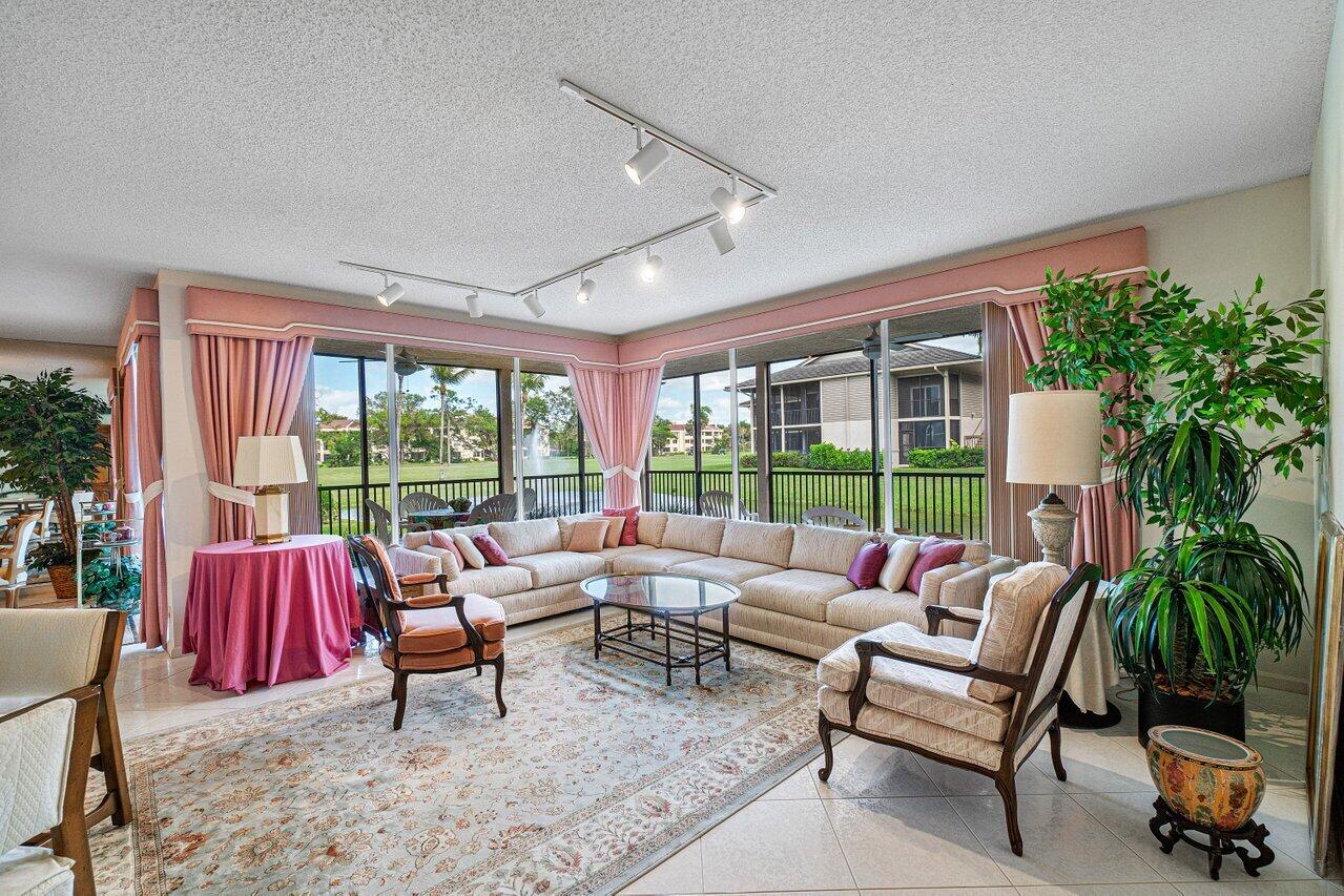 7641 Cinebar Drive, Unit 25L Boca Raton, FL 33433 - Photo 3 of 19 Living Room with views of lake and golf