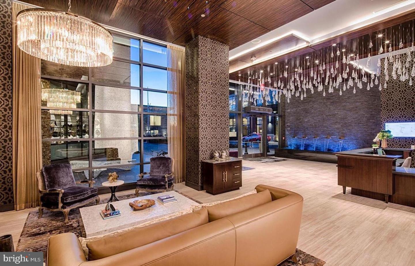 45 Sutton Square Southwest, Unit 1115 Washington, DC 20024 - Photo 4 of 14 a living room with furniture and wooden floor