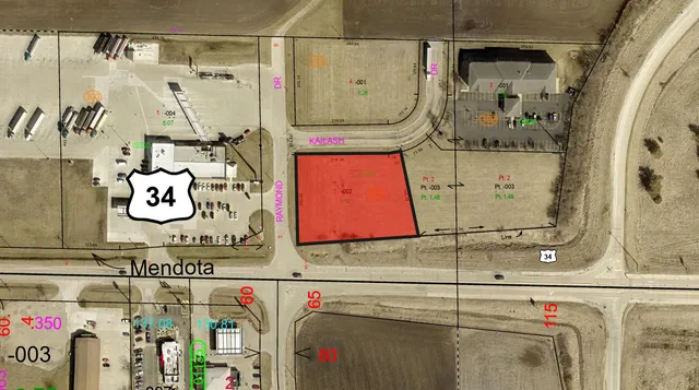 a utility room with a wooden floor and cabinets