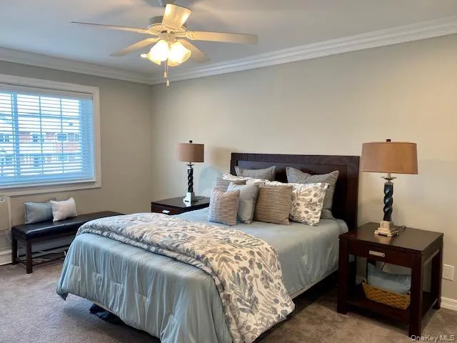 a bedroom with bed and a window