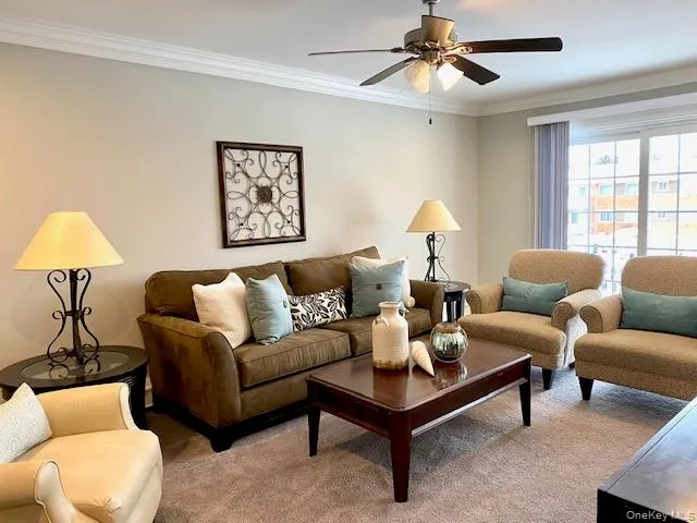 a living room with furniture and a lamp