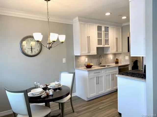 a kitchen with a table and chairs