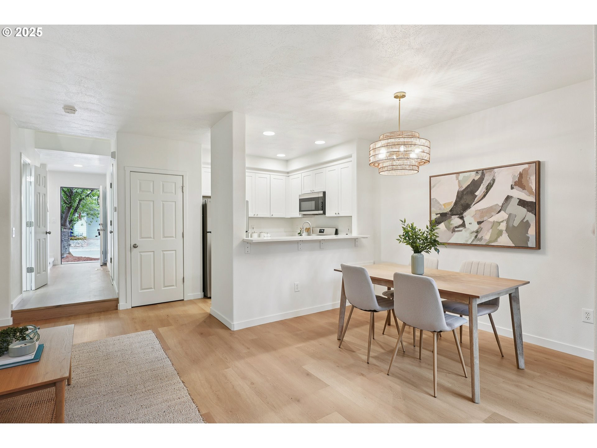912 Southeast 193rd Avenue Portland, OR 97233 - Photo 11 of 28 a view of a dining room with furniture and wooden floor