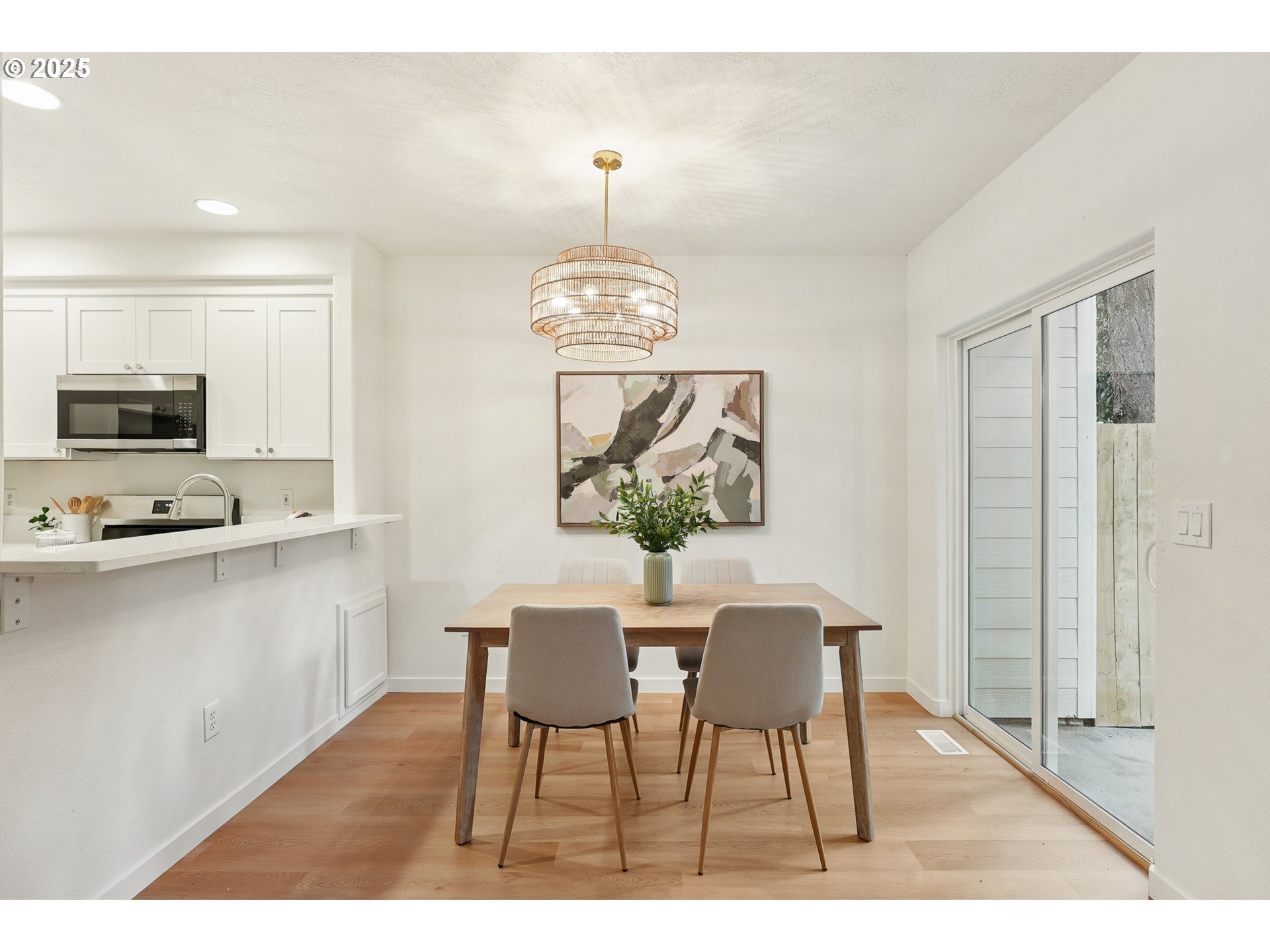 912 Southeast 193rd Avenue Portland, OR 97233 - Photo 15 of 28 a view of a dining room with furniture window and wooden floor