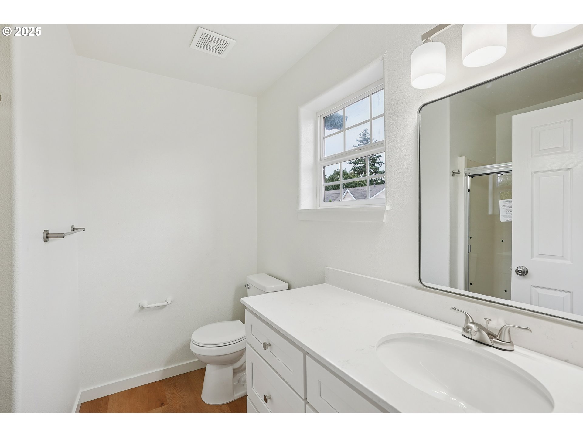 912 Southeast 193rd Avenue Portland, OR 97233 - Photo 19 of 28 a bathroom with a toilet a sink and mirror