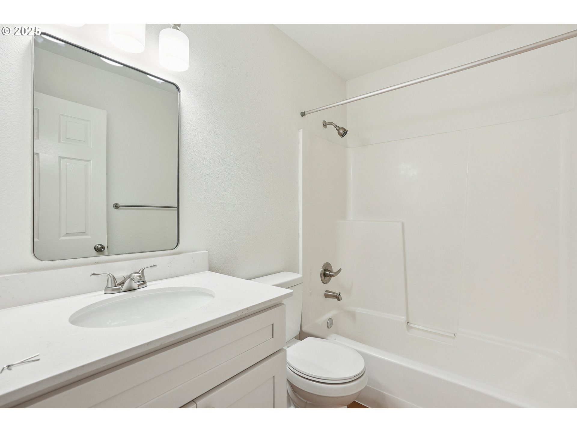 912 Southeast 193rd Avenue Portland, OR 97233 - Photo 25 of 28 a bathroom with a sink toilet a mirror and shower