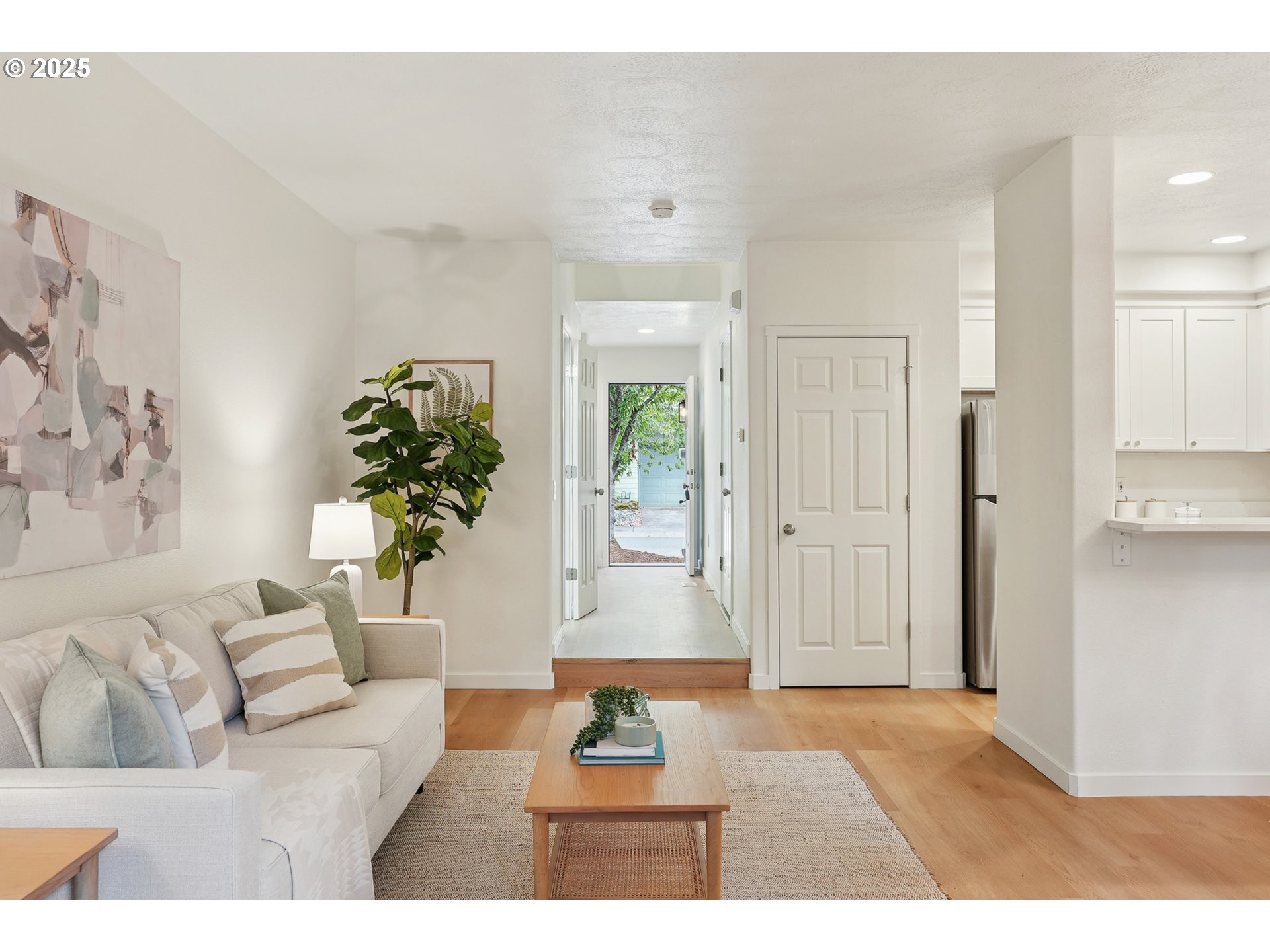912 Southeast 193rd Avenue Portland, OR 97233 - Photo 5 of 28 a living room with furniture and a potted plant