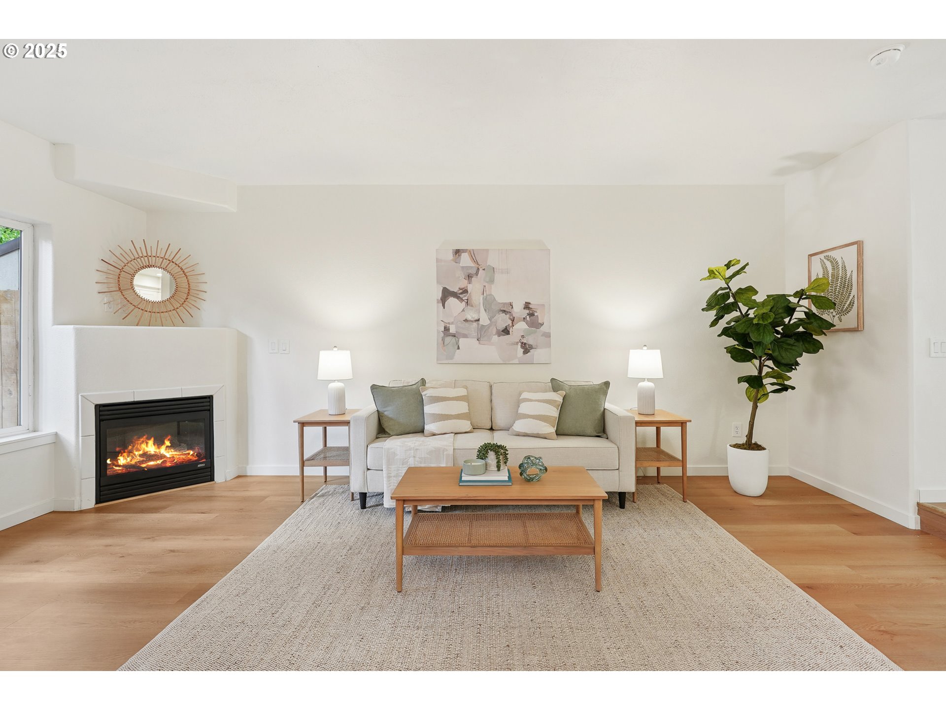 912 Southeast 193rd Avenue Portland, OR 97233 - Photo 9 of 28 a living room with furniture and a fireplace