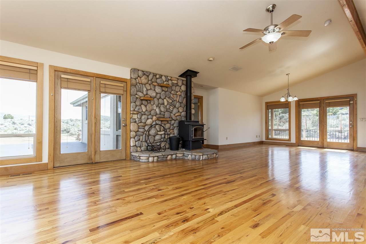 505 Space Test Road Reno, NV 89510 - Photo 18 of 25 a view of an empty room with window and wooden floor