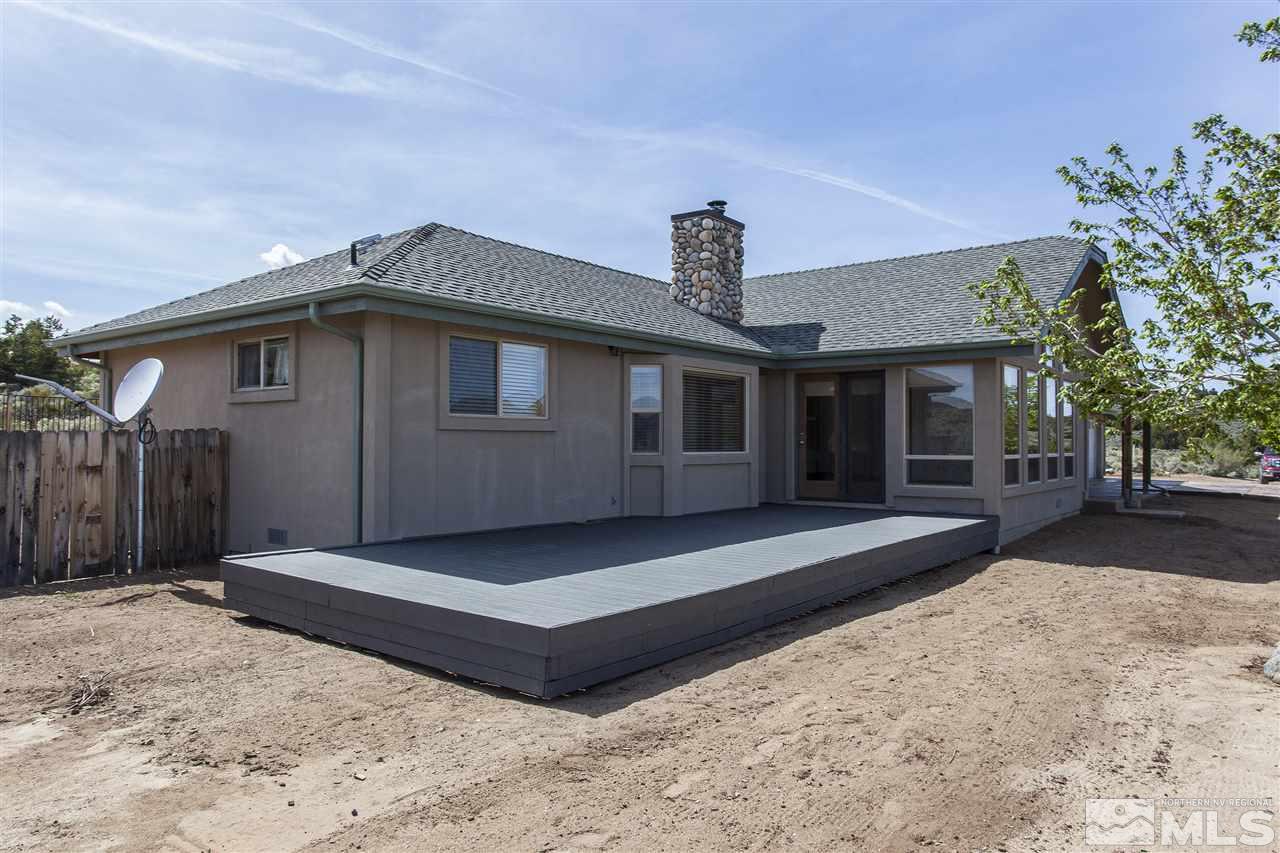 505 Space Test Road Reno, NV 89510 - Photo 3 of 25 a front view of a house with a garden and yard