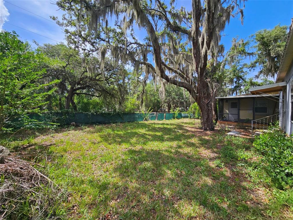8603 Alafia Ridge Road Riverview, FL 33569 - Photo 8 of 13 a view of outdoor space with deck and garden