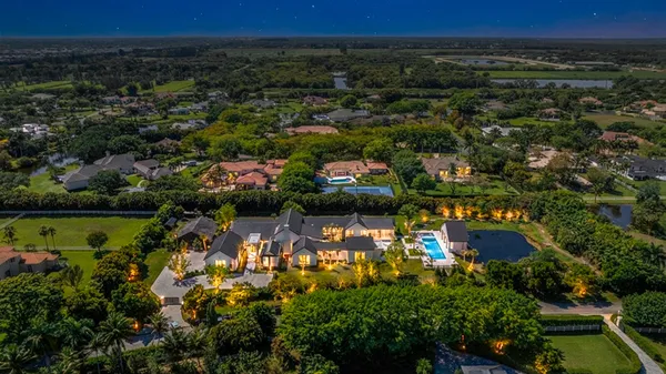 an aerial view of houses with yard