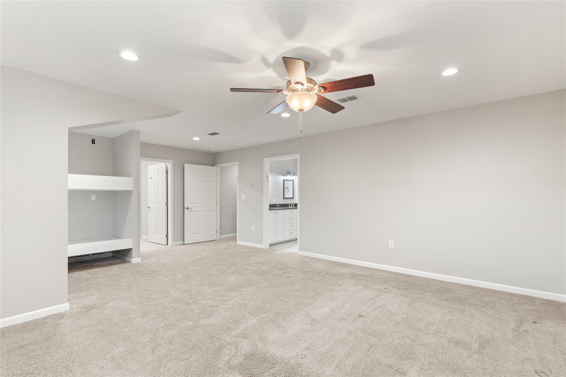1293 Pioneer Road Seguin, TX 78155 - Photo 34 of 40 A spacious bedroom with a built-in bunk area and direct access to a private bathroom.