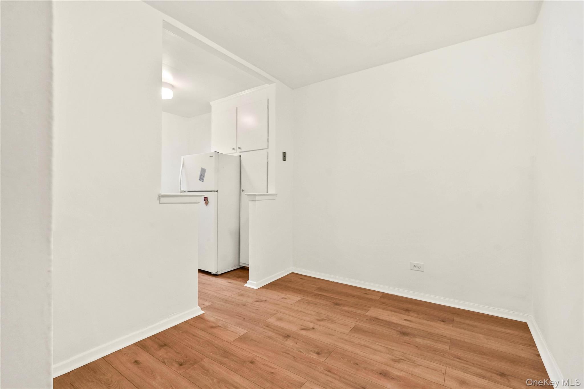 110-15 71st Road, Unit 6J Queens, NY 11375 - Photo 13 of 23 a view of empty room with wooden floor