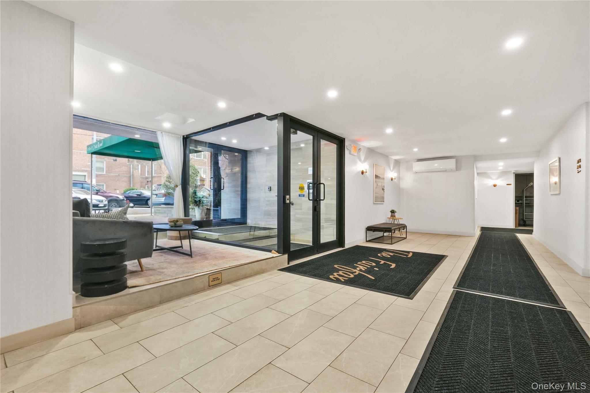 110-15 71st Road, Unit 6J Queens, NY 11375 - Photo 20 of 23 a large kitchen with kitchen island granite countertop a refrigerator and a sink