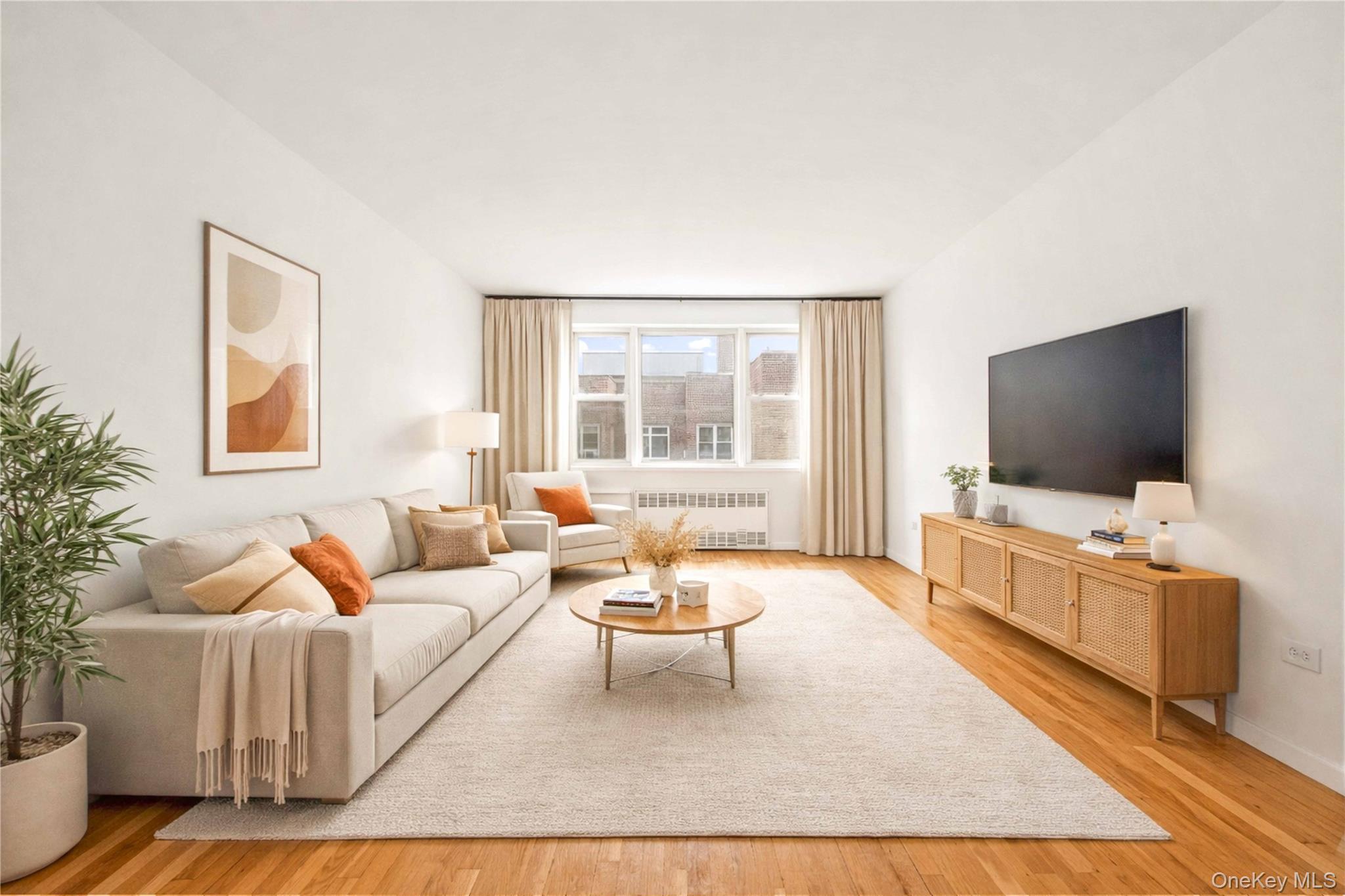 110-15 71st Road, Unit 6J Queens, NY 11375 - Photo 2 of 23 a living room with furniture and a flat screen tv