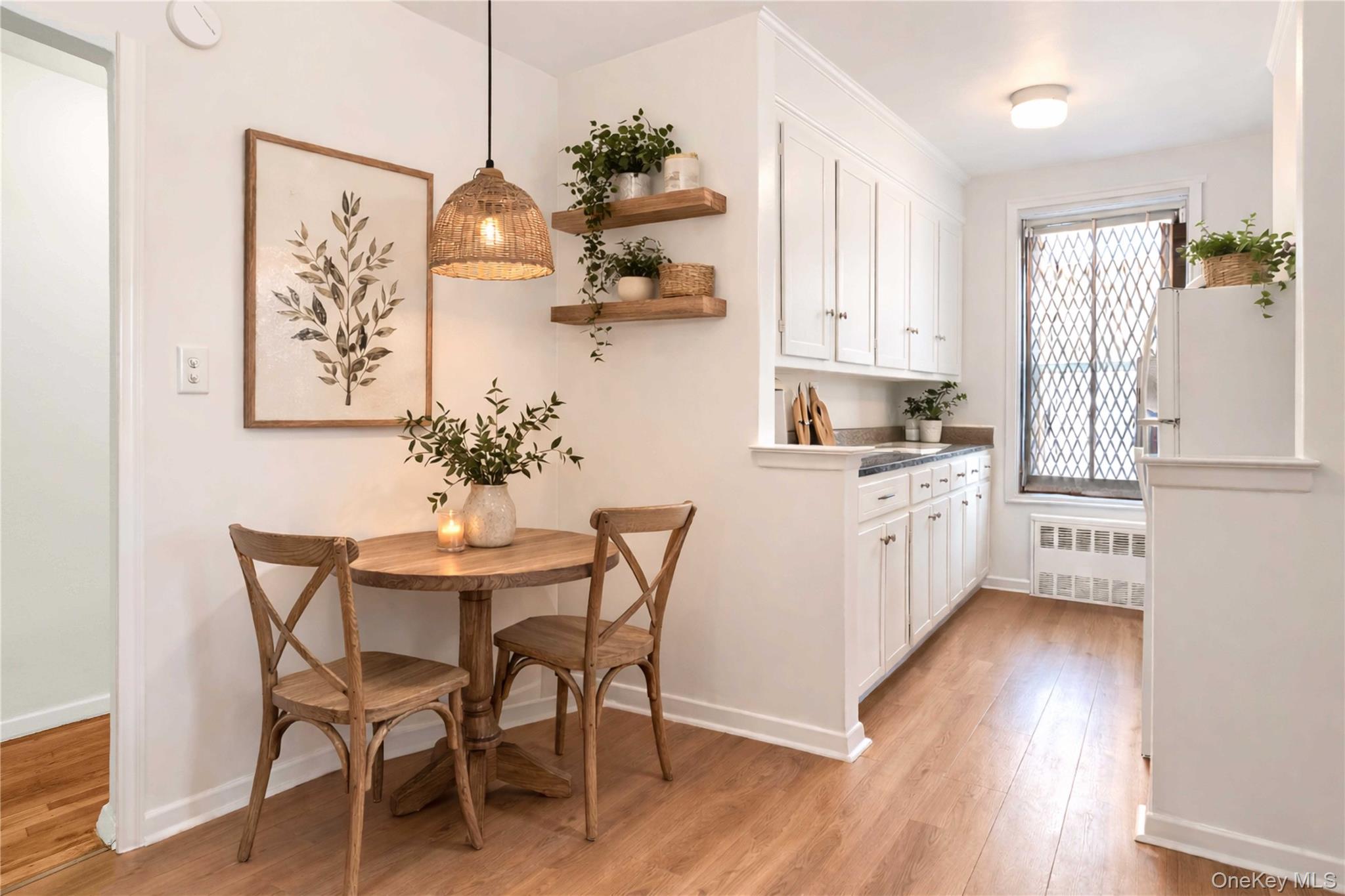 110-15 71st Road, Unit 6J Queens, NY 11375 - Photo 4 of 23 a view of a dining room with furniture and wooden floor